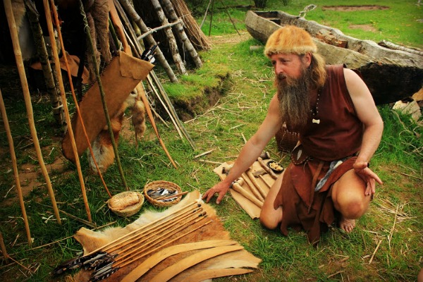 Showing different Neolithic weapons at the Stone Age Park.