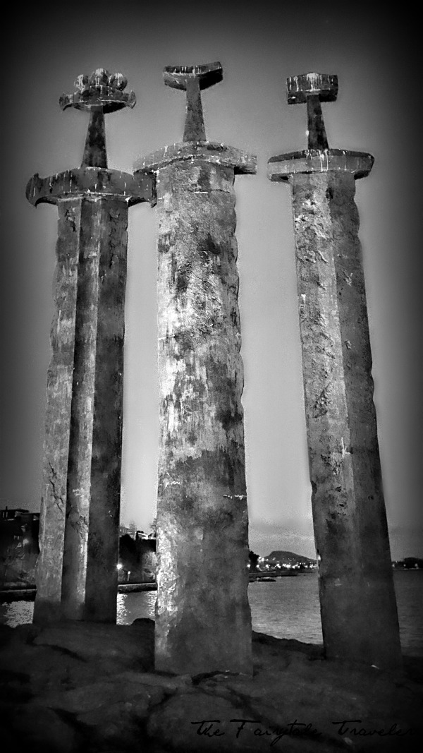 A black and white of the Three Swords Monument. Which stands about 33 feet tall.
