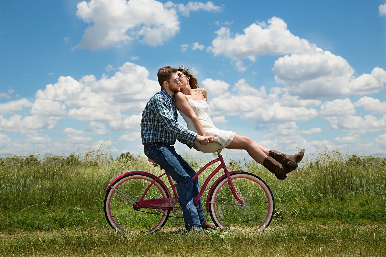 couple riding a bike, active date ideas